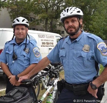 Bike patrol officers Christopher Glascock and Eric Frost at the Petworth Jazz Project.