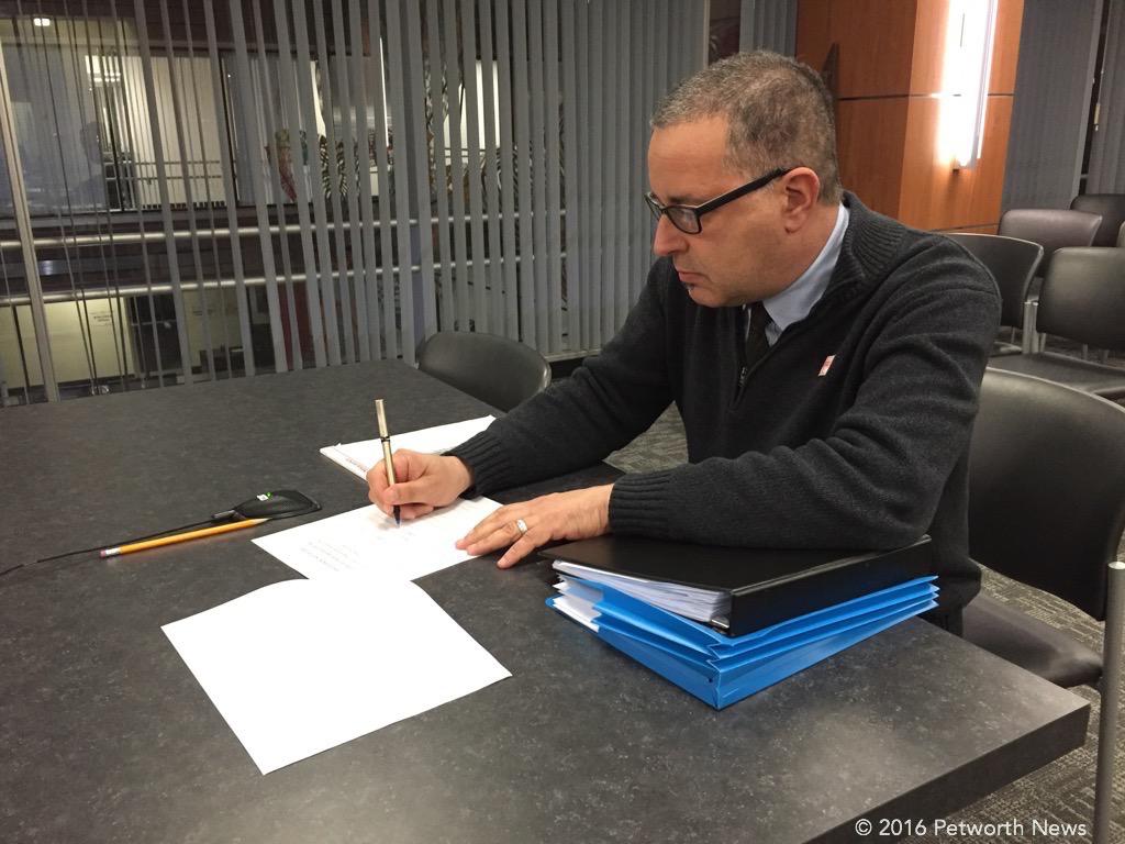 Commissioner David Sheon preparing to present the community's concerns at the protest hearing.