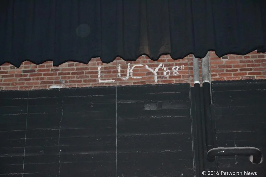 An old piece of graffiti left at the back of the stage, up by the ceiling...