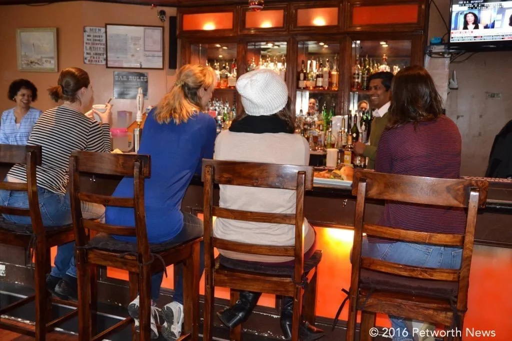 Patrons hanging out at the bar of the Hitching Post, 200 Upshur St NW