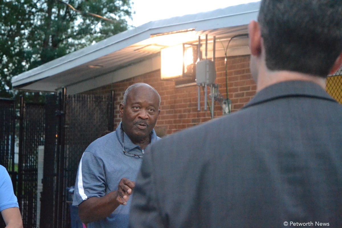 Resident Colbert King speaks to Deputy Mayor Kevin Donahue