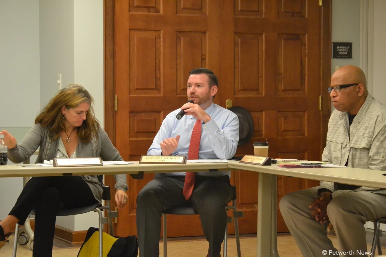 Commissioners Maria Barry, John-Paul Hayworth and Taalib-Din Uqdah