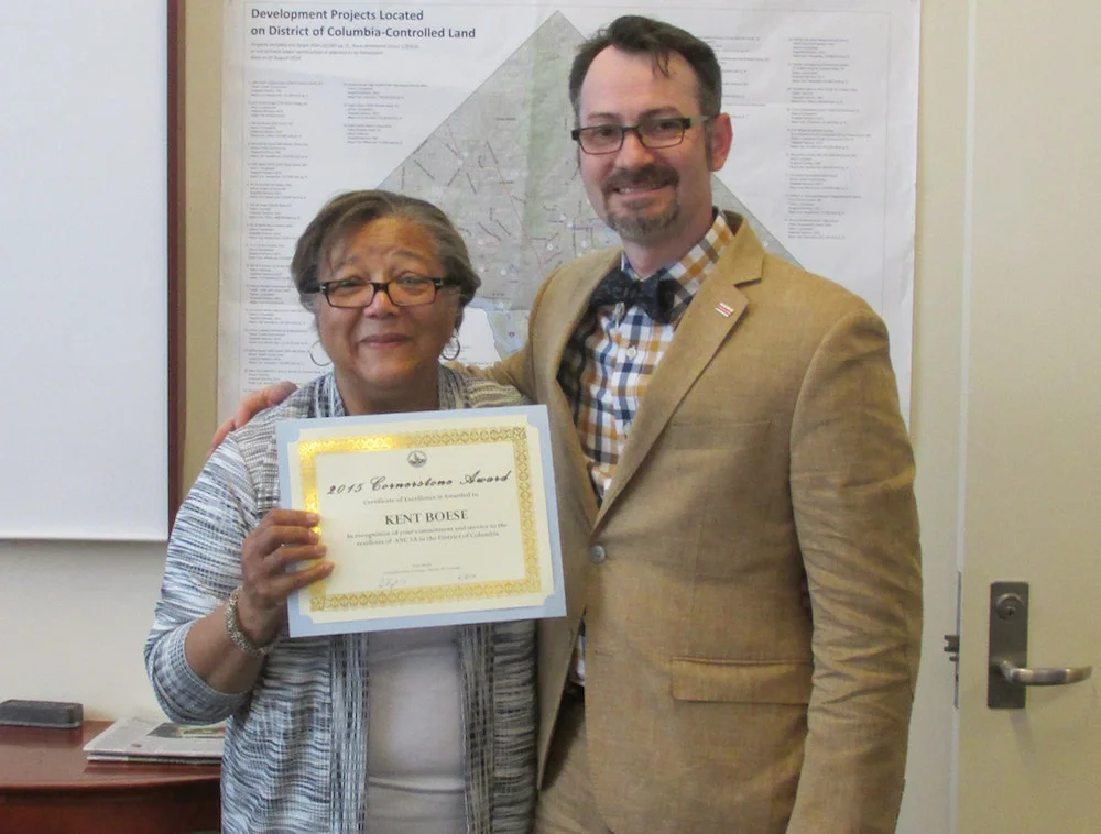 At-Large Councilmember Anita Bonds awarding a Cornerstone Award to Commissioner Kent Boese for his community service.