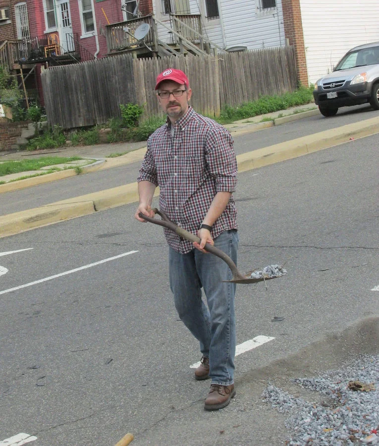 Clearing gravel from Warder Street Bike Lane