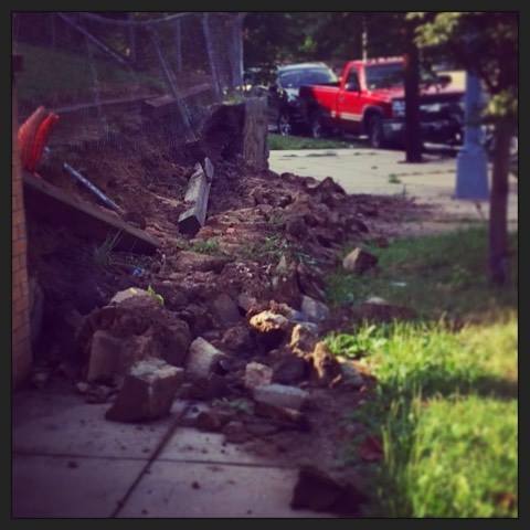 A collapsed retaining wall at Illinois Ave and 8th Street