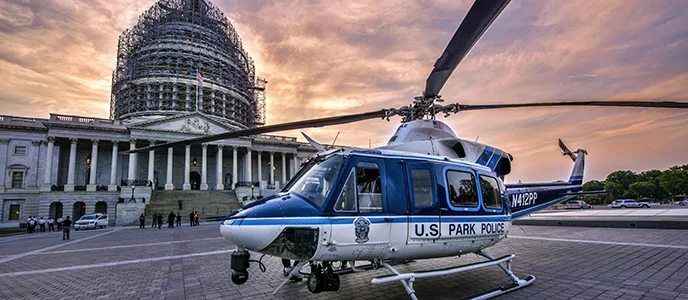 The United States Park Police helicopter "Eagle 2" near the United States Capitol Building. (Courtesy NPS / R. MULLER)