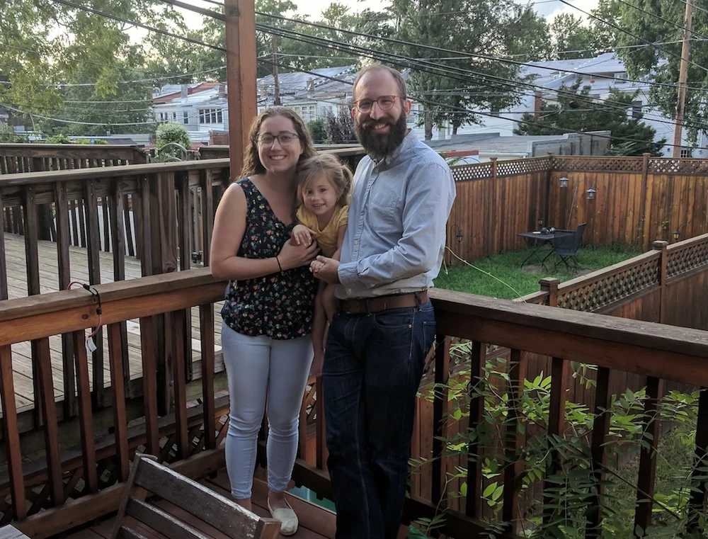 Zach Teutsch and his family in the backyard of their Petworth home.