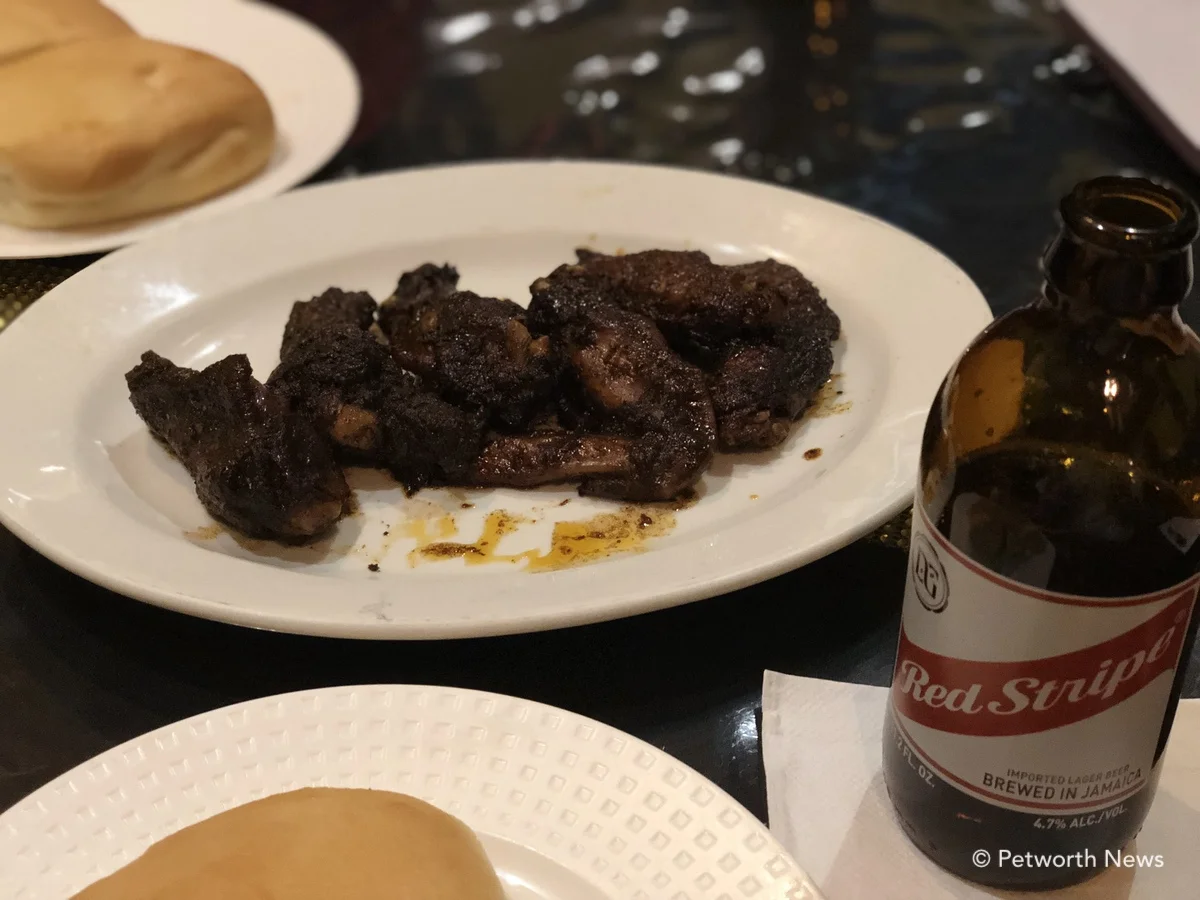 Jerk chicken wings and coco bread are a great combo.