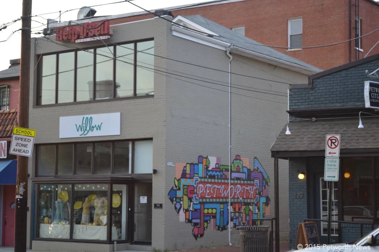 The building at 843 Upshur Street has become famous for the Petworth mural and Willow Fashion, along with the Help-U-Sell Brokerage upstairs.