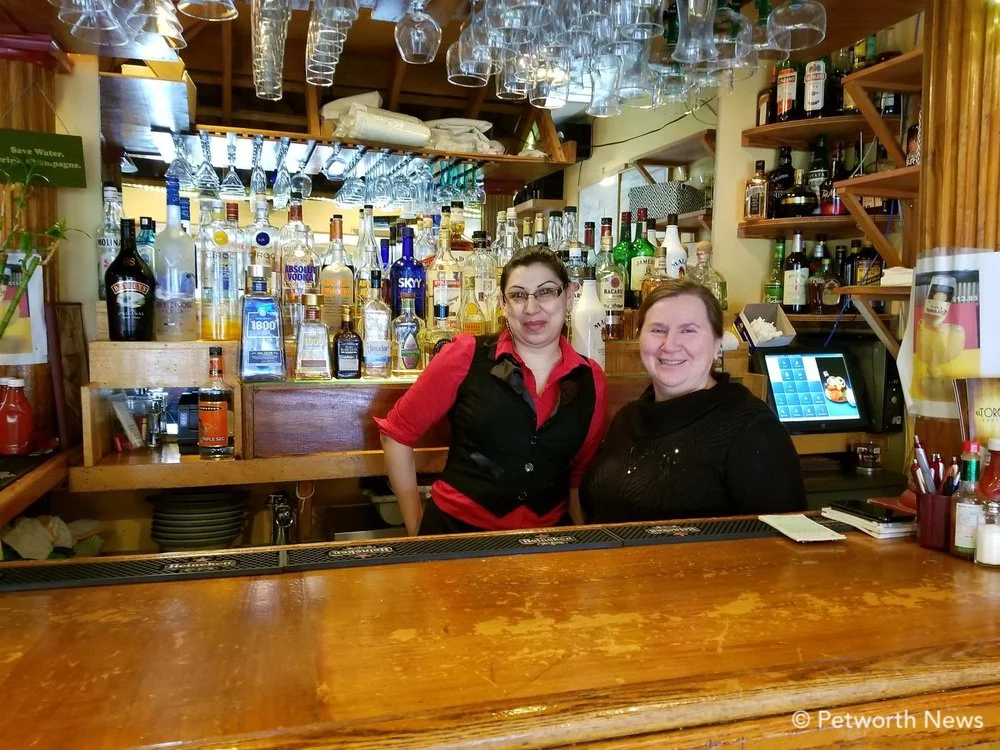 El Torogoz manager Coralia Ventura (right) poses with an El Torogoz waitress.