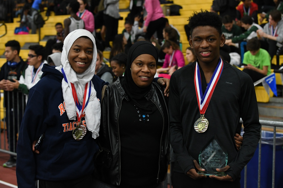 Taahir posing with his sister and mother after a race this year and receiving Athlete of the Year award. (photo courtesy of Taahir Kelly)