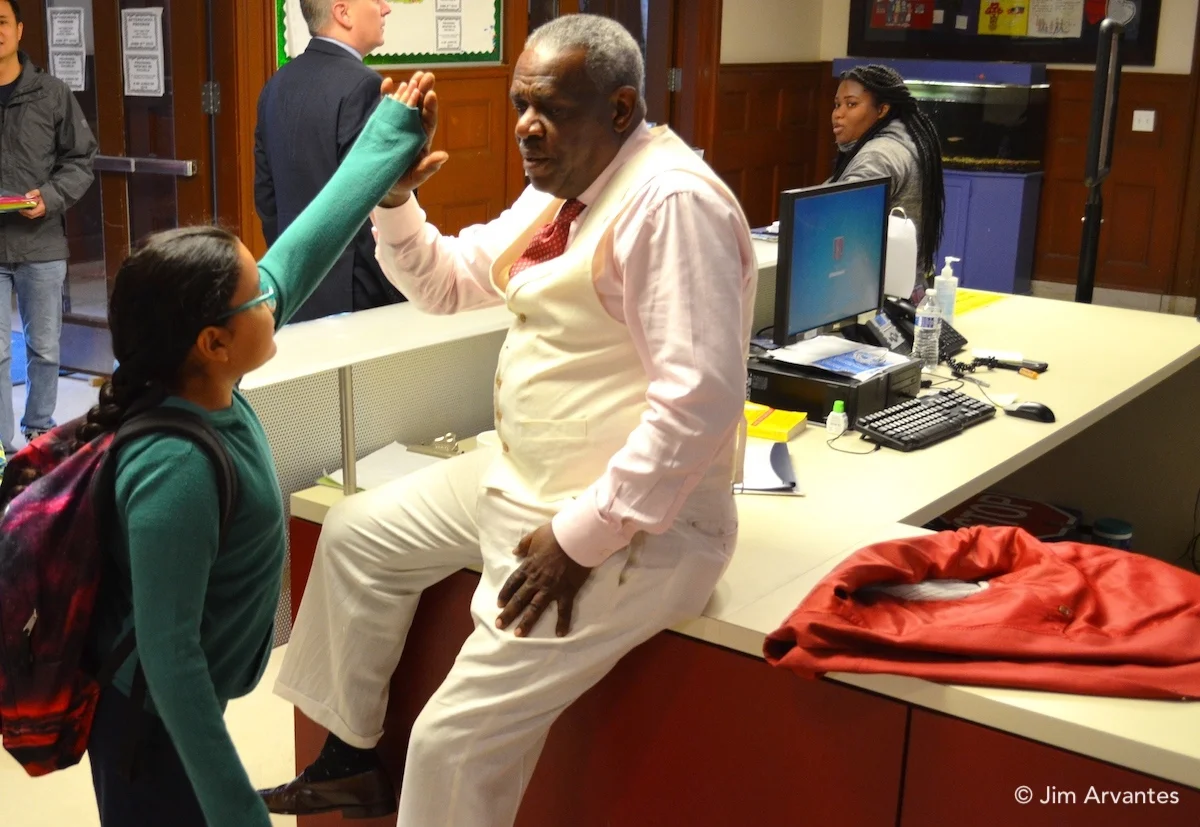 Ted Hinton greets a student during the last week of school, his last with the school system.