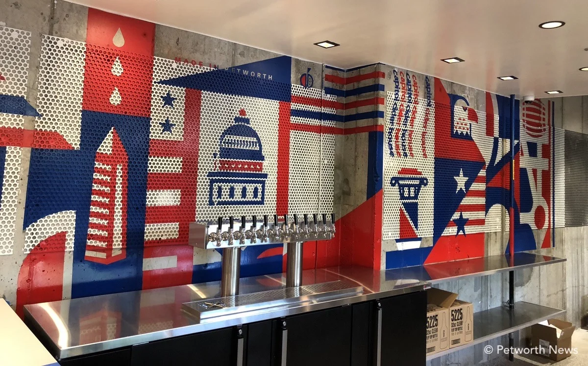 The original mural behind the bar was hand-painted by No Kings Collective.