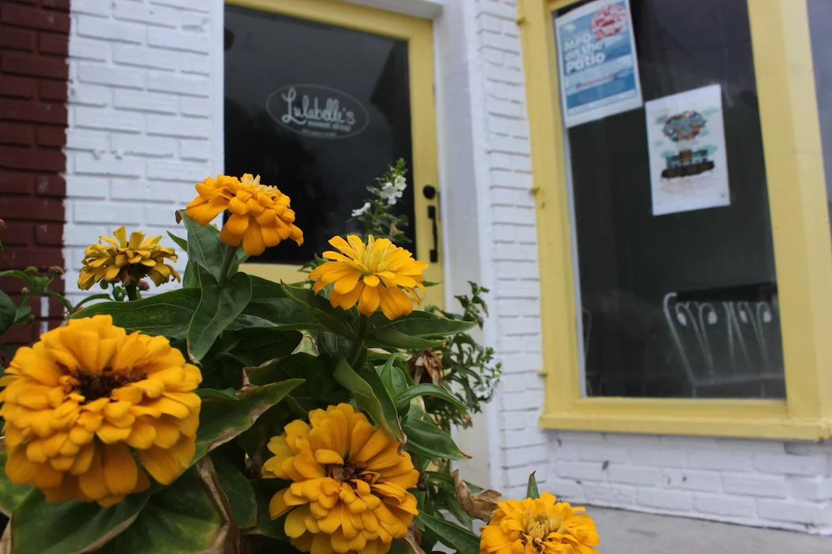 Zinnias color coded with the door, windows and ice cream cups of Lulabelle’s Sweet Shop.