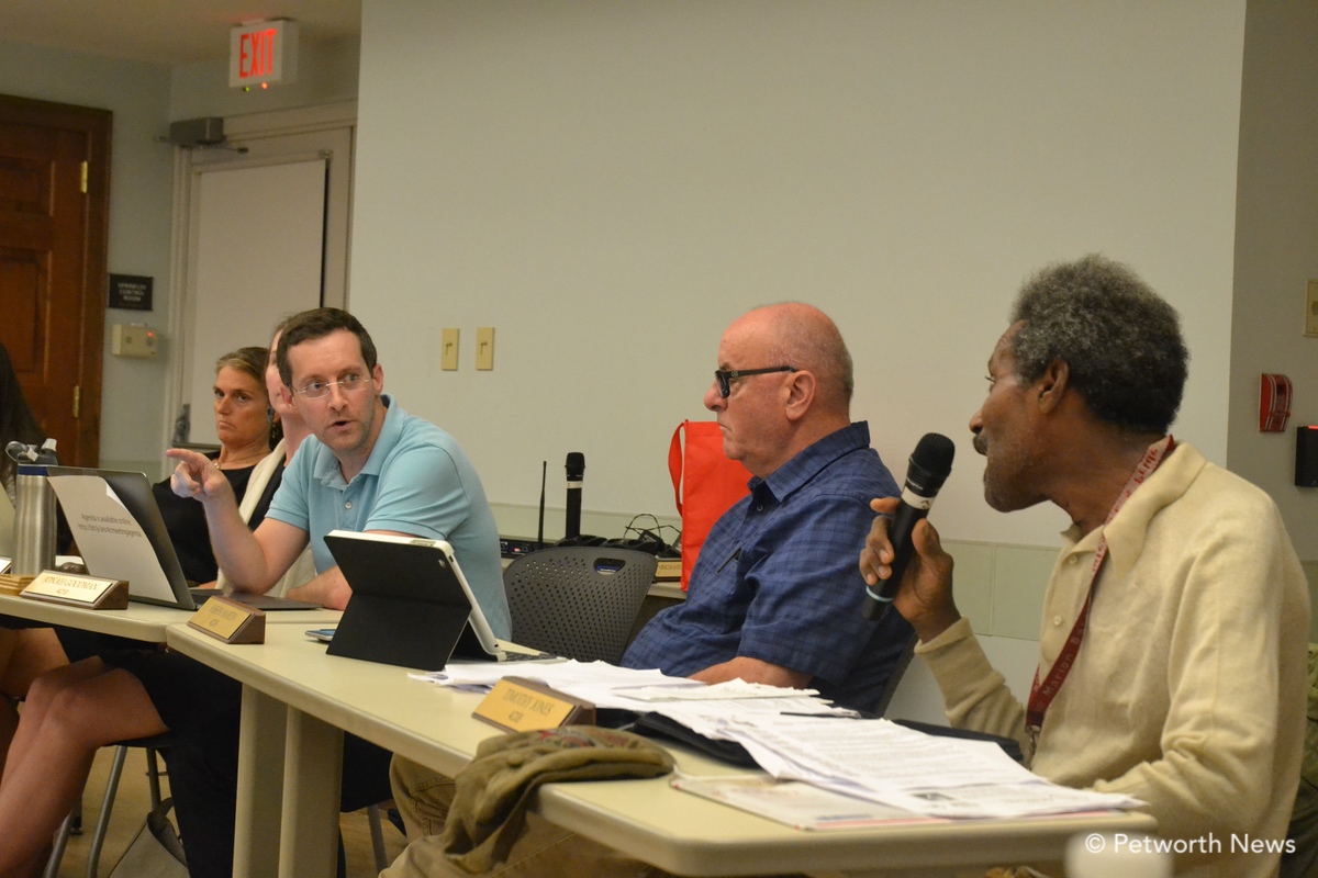 Commissioners Goodman and Jones argue about Zoning approvals in the neighborhood.