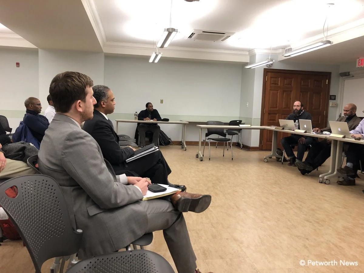 Commissioner Zach Teutsch speaking as Councilmember Brandon Todd listens.
