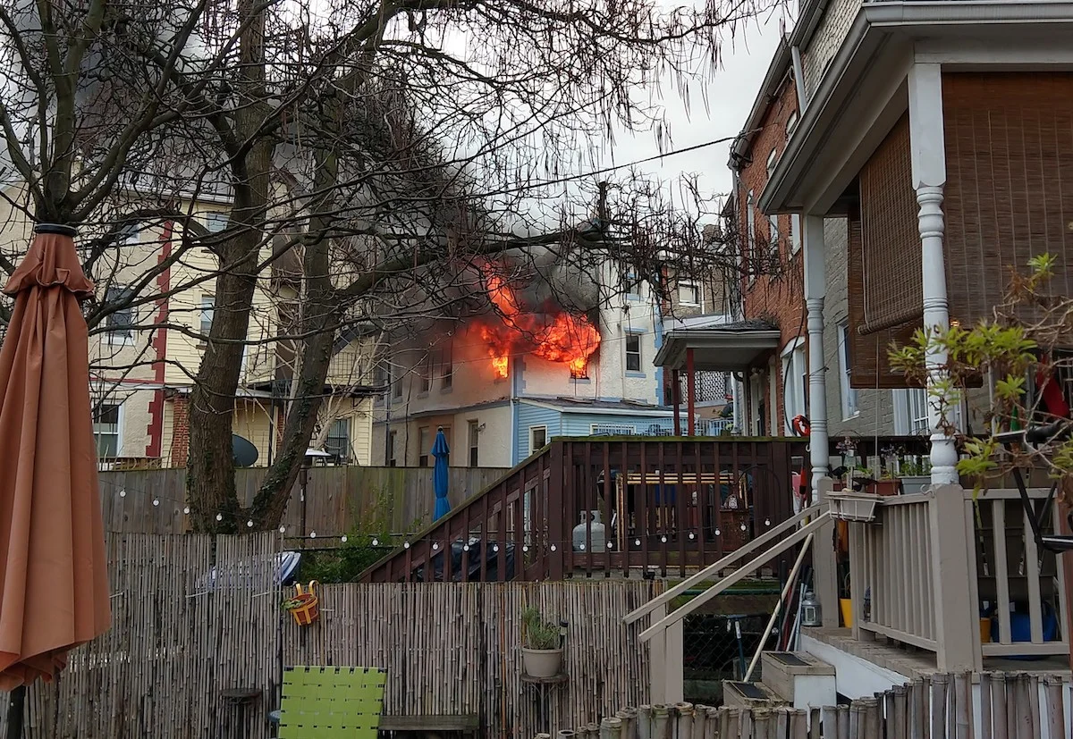 Fire blazes out of the top floor of a house on Randolph Street shortly before DC Fire arrived (photo: D. Astudillo)