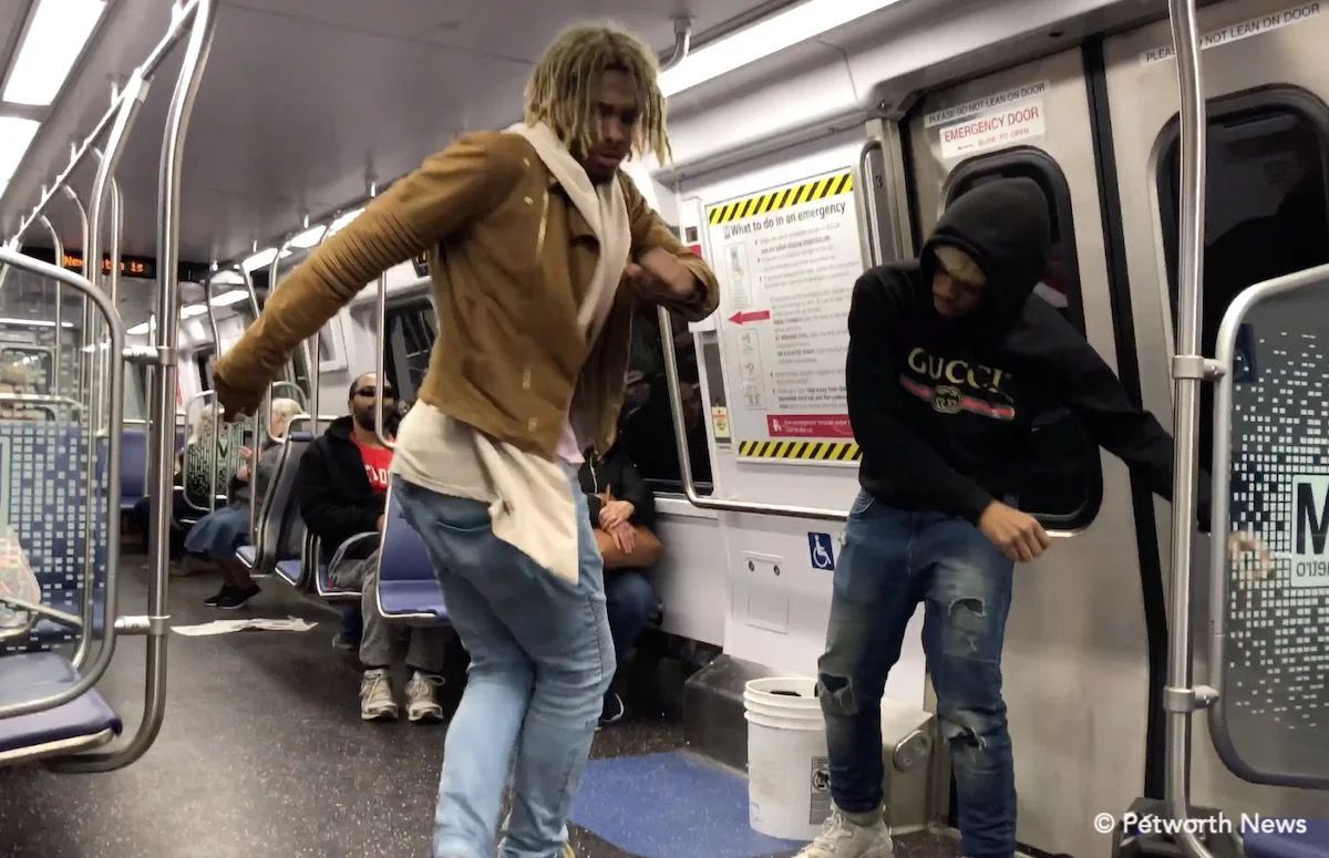 Key (left) and Quest (right) dancing for riders on the Green line