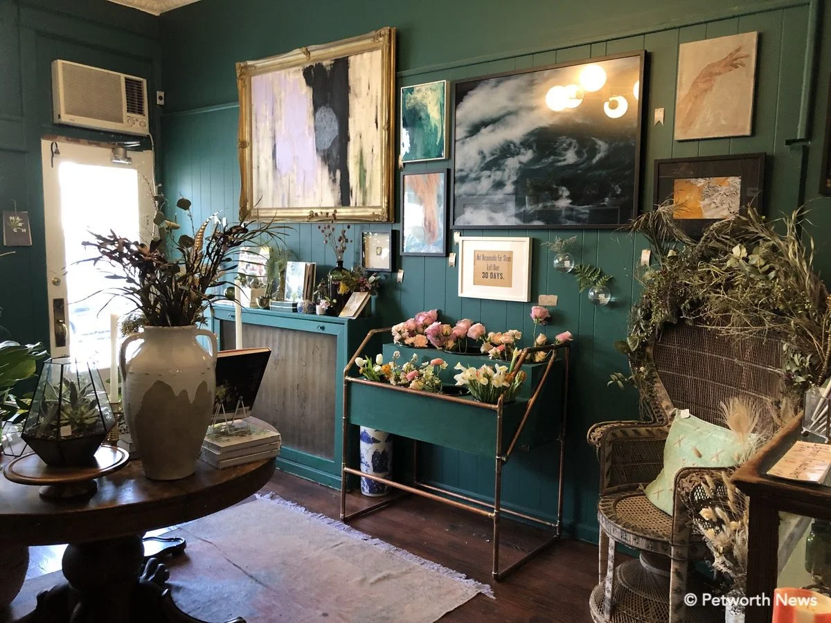 The interior of She Loves Me is filled with plants, art, jewelry and other amazing items.