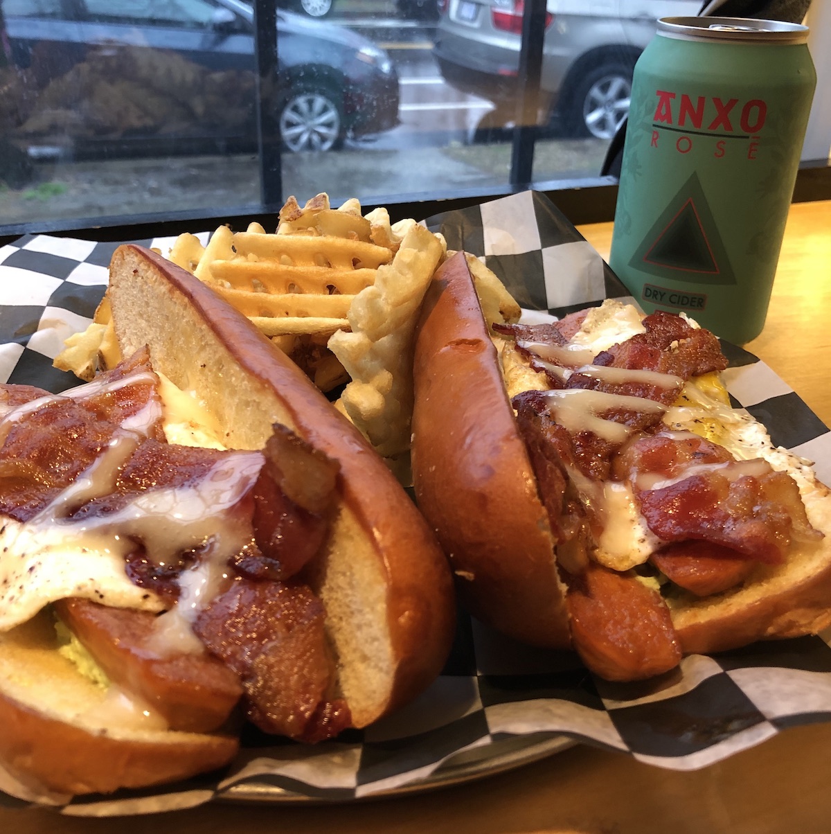 The Morning Glory Hot Dog… Applewood smoked bacon, fried eggs over easy, jalapeno cream cheese and maple syrup aioli.