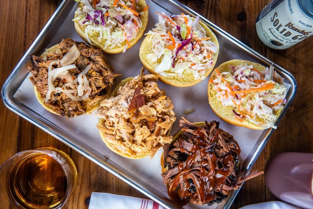 Pulled pork, pulled chicken and brisket sandwiches. (photo: Cinder BBQ)