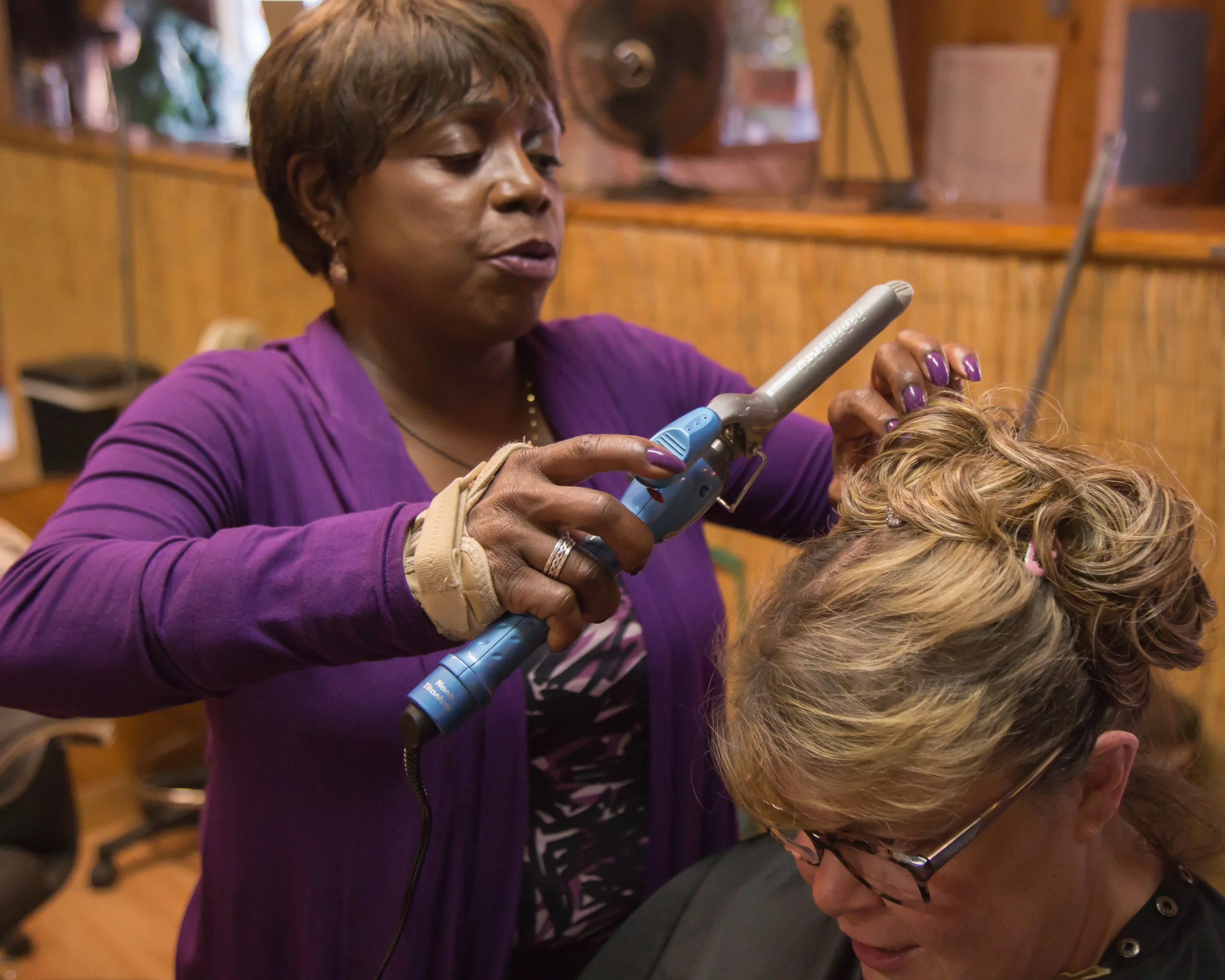 Wanda styles and chats with Barbara Burns, owner of the Hair Hut in Boulder Creek where Wanda worked for years—the only Black stylist in San Lorenzo Valley. People still stop her and exclaim, ‘Wanda, you used to do my hair!’