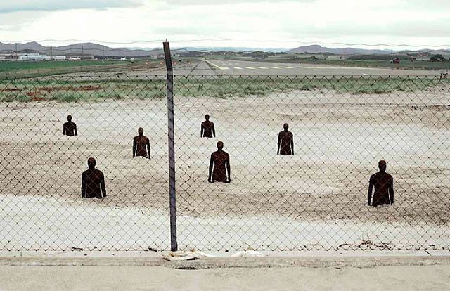 Antony Gormley, Another Place (1997)
Crosby, Liverpool U.K. 
100 cast-iron, life-size figures spread out along three kilometres of the foreshore, stretching almost one kilometre out to sea. &quot;The sculptures are made from 17 body-casts taken from 