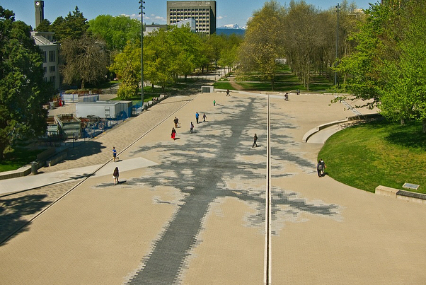 Esther Shalev-Gerz, The Shadow (2018) 
Vancouver 
Commissioned by UBC, Vancouver, Photograph Robert Keziere

24000 three-shade concrete pavers, 100x25m
Esther Shalev-Gerz&rsquo;s commission The Shadow embeds the ghostly silhouette of a first-growth D