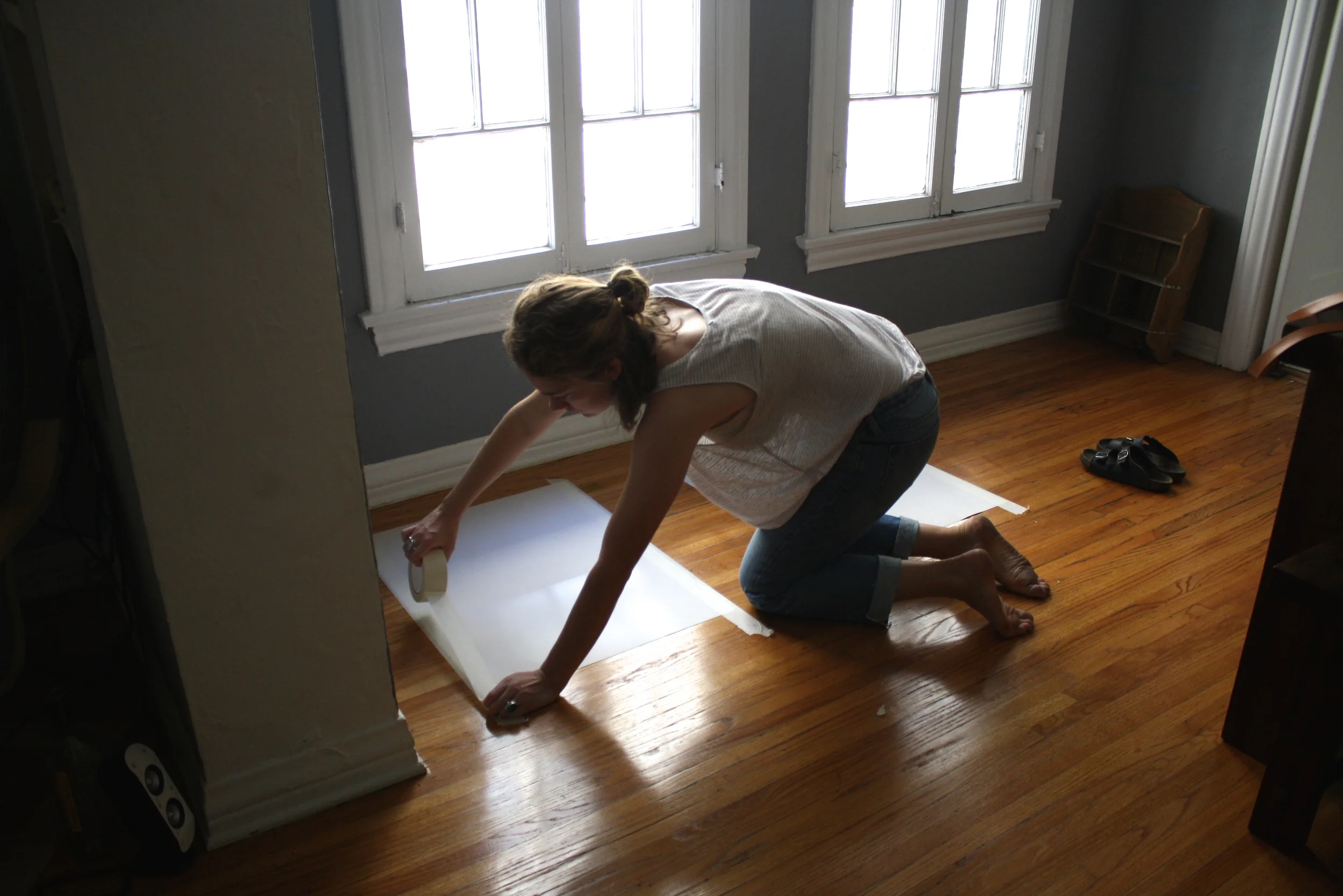 Here is me taping down the images where they will live for 24-48 hours. 