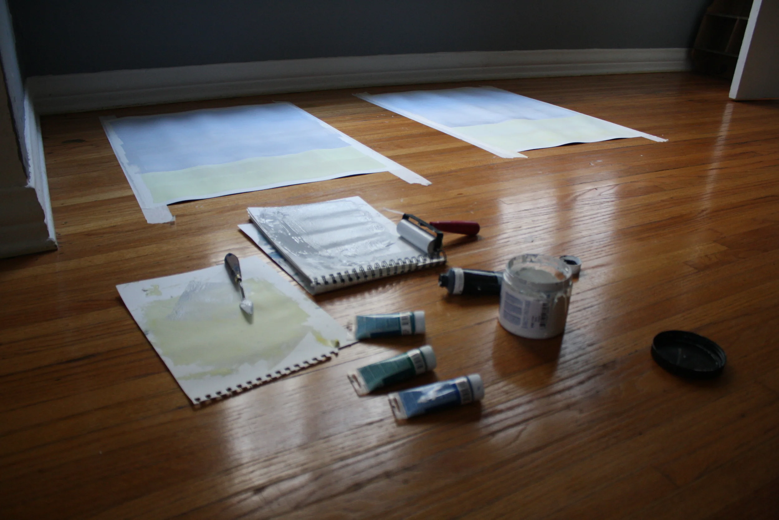 The sky layer is a light light grey. After this I put the dark grey/blue water down. 