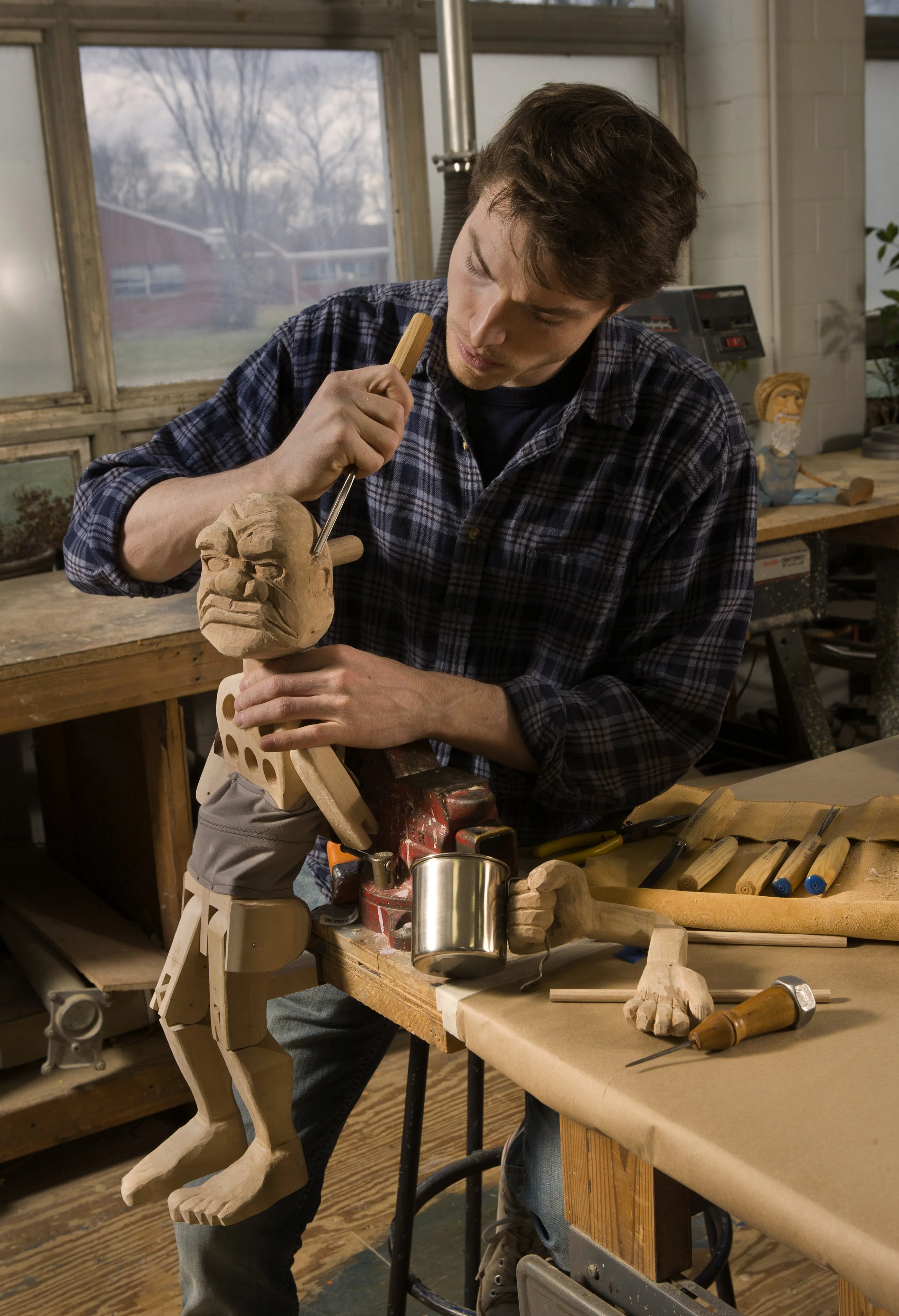 Mark Blashford carves a puppet at the University of Connecticut