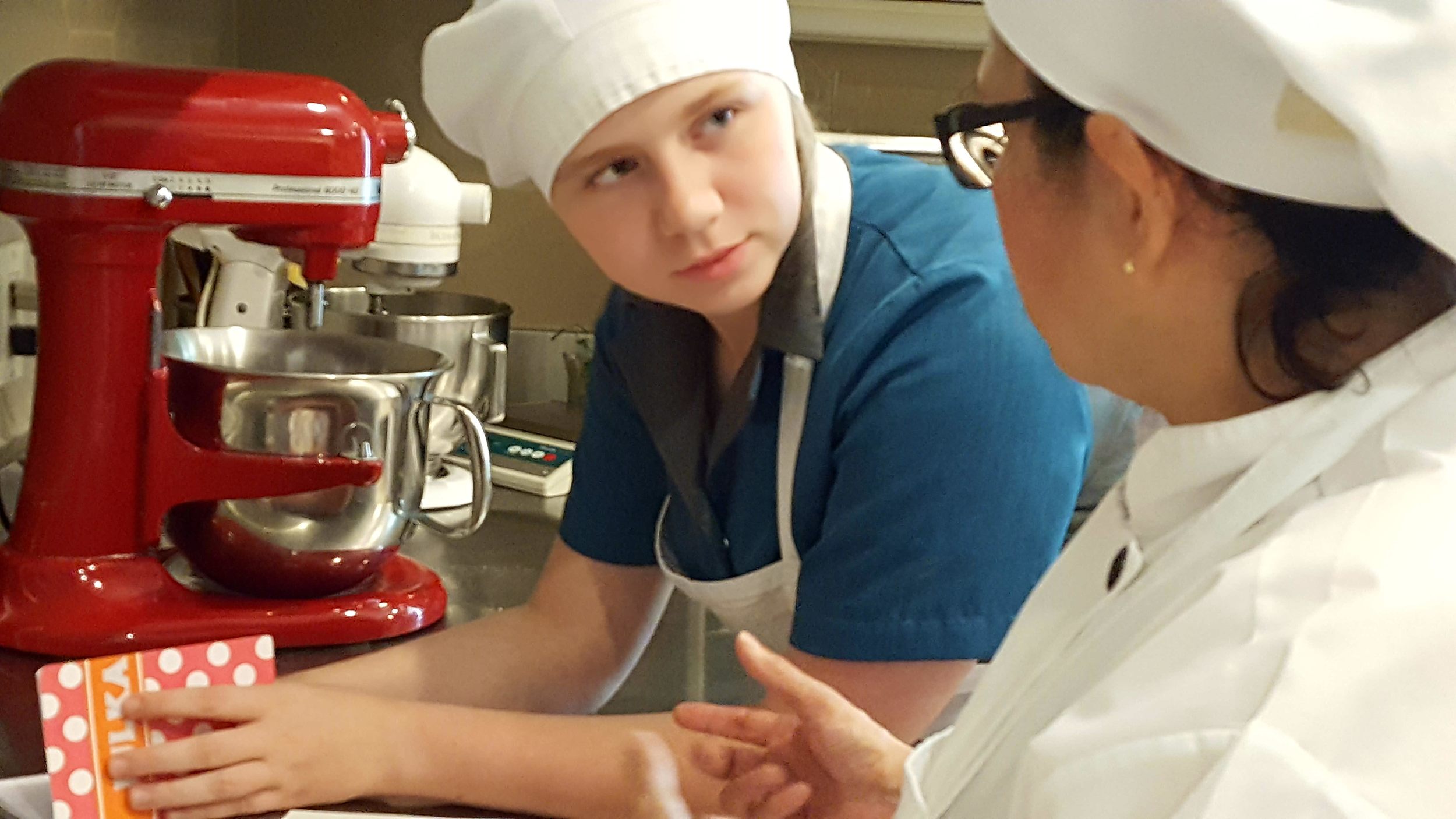 Julka settles in with baking instructor Gabriela.