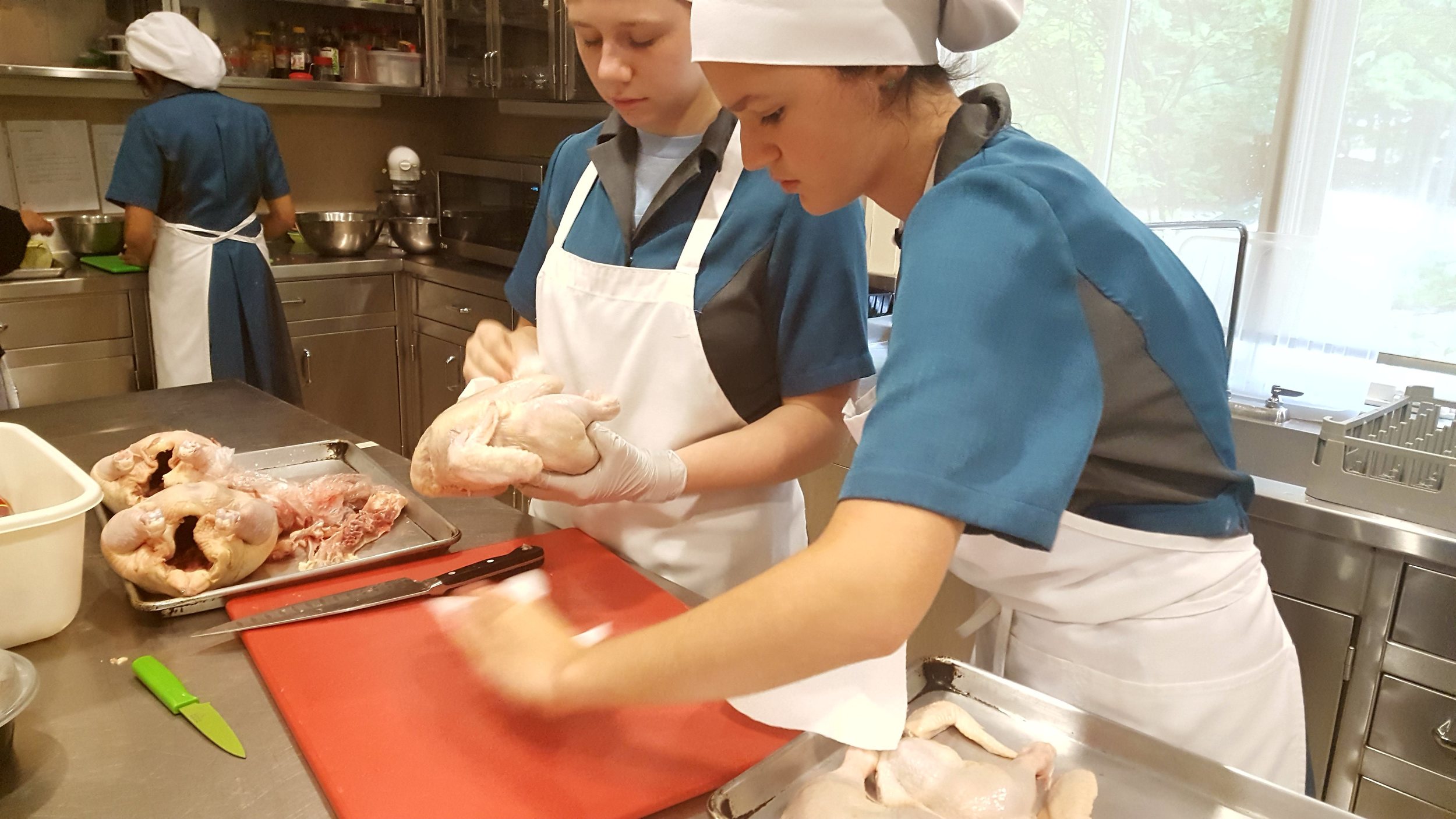 Caroline's specialty - cutting up chickens!