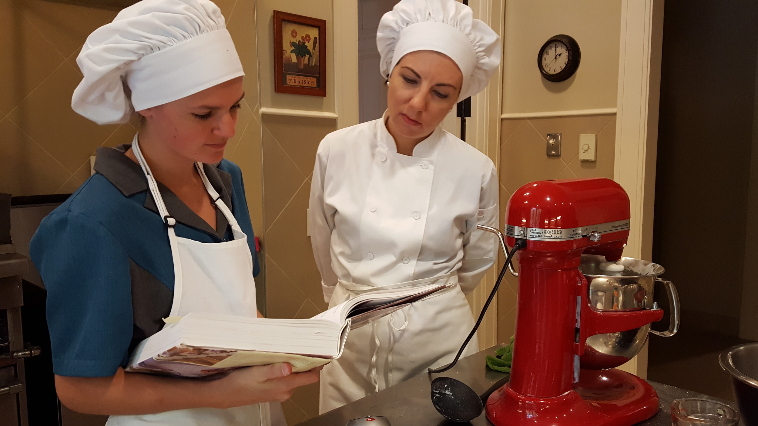 Consultation with kitchen instructor, Caroline