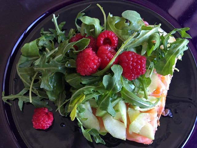 Smoked salmon with cream cheese on oat-flax crisp bread, topped with shaved cucumber, Moscatel wine vinegar and olive oil drizzled baby arugula, studded with fresh raspberries. #lunch #brunch #breakfast #snack #dinner #healthyfood #homemade #homecook