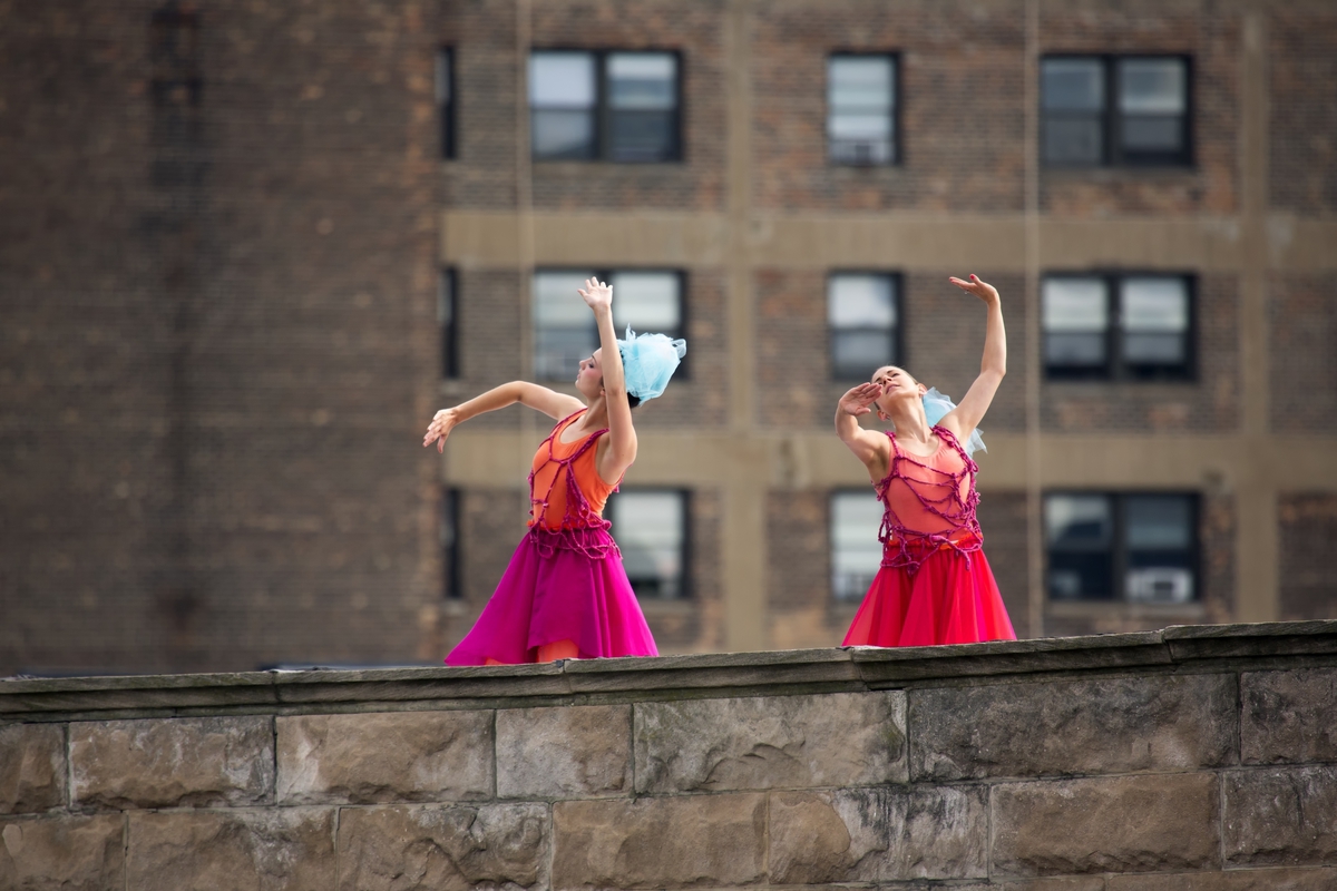 Photos by Betty Udesen Wake Up! Waltz places dancers on top of mixed-use and commercial real estate as commuters make their way to work during the weekday morning rush hour. First appearing in Chicago in 2013 for 4 consecutive weeks in the South Shore, Uptown, and Logan Square neighborhoods, Wake Up! Waltz transforms the way commuters and residents connect with their urban surroundings and activates the imagination through live, public performances of the waltz, infused with jazz, hip hop, contemporary and latin dance. Wake Up! Waltz is a free, dynamic, multi-site campaign that transforms the way commuters interact with one another, their city, the workday, and the world, with live performances appearing in the most unlikely of places at the most unexpected time of day. Wake Up! Waltz Website