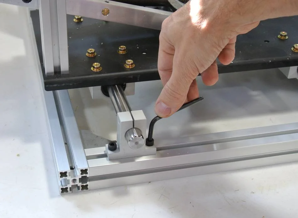 Tighten the mounting screws for the shaft holders.