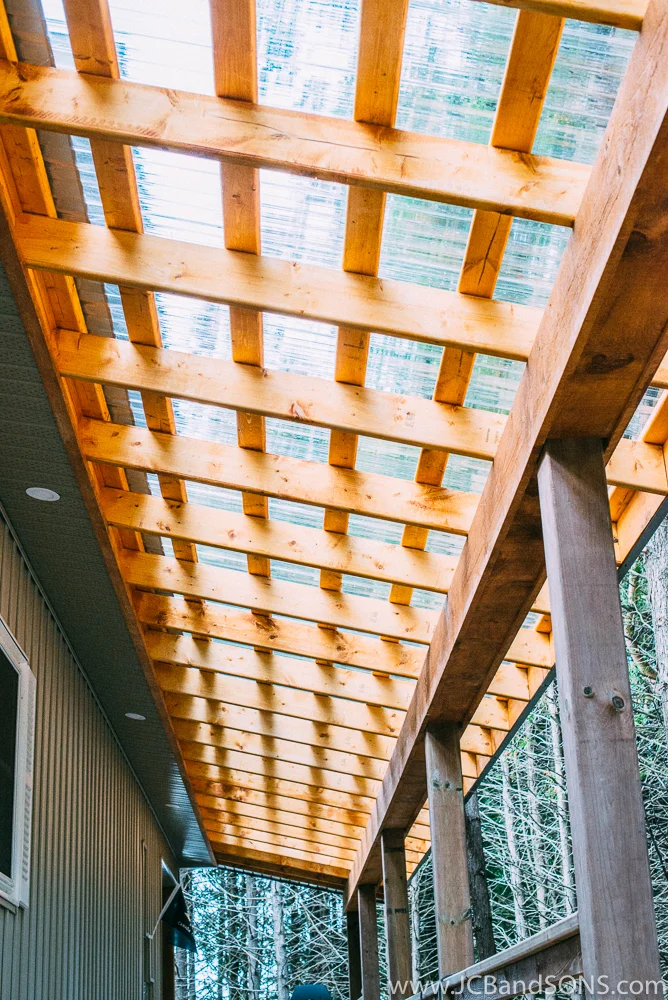 The wooden structural beam was clad in pine barn board and finished with a coat of Sikkens Cedar Stain.