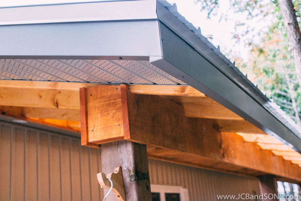 We installed new vented soffit on the ends to tie neatly into the home and clad all the fascia boards in aluminum fascia we custom bent on site.