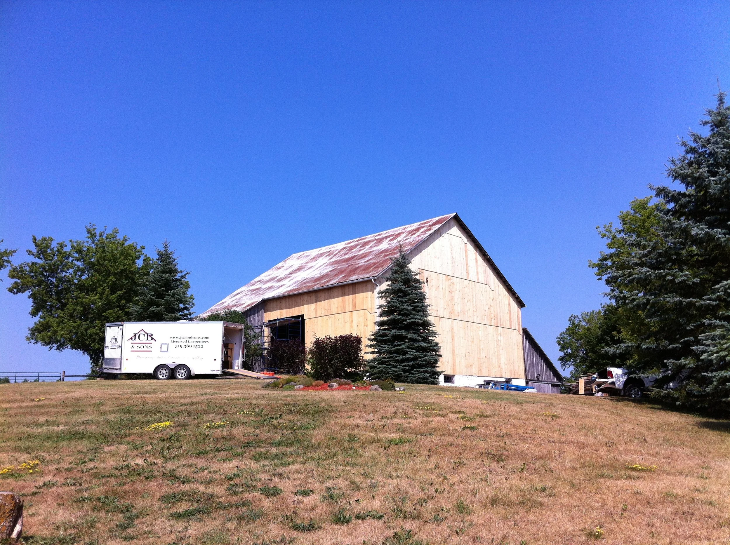 Bank barn with new siding installation – serving Mount Forest sheds and outbuildings