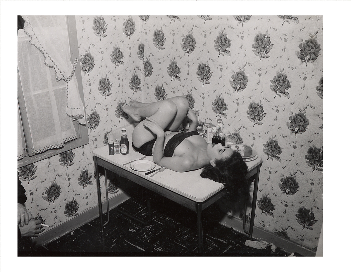 In this odd and kinky fetish photograph, the man’s hands in the bottom of the left corner signify everything. c. 1950.