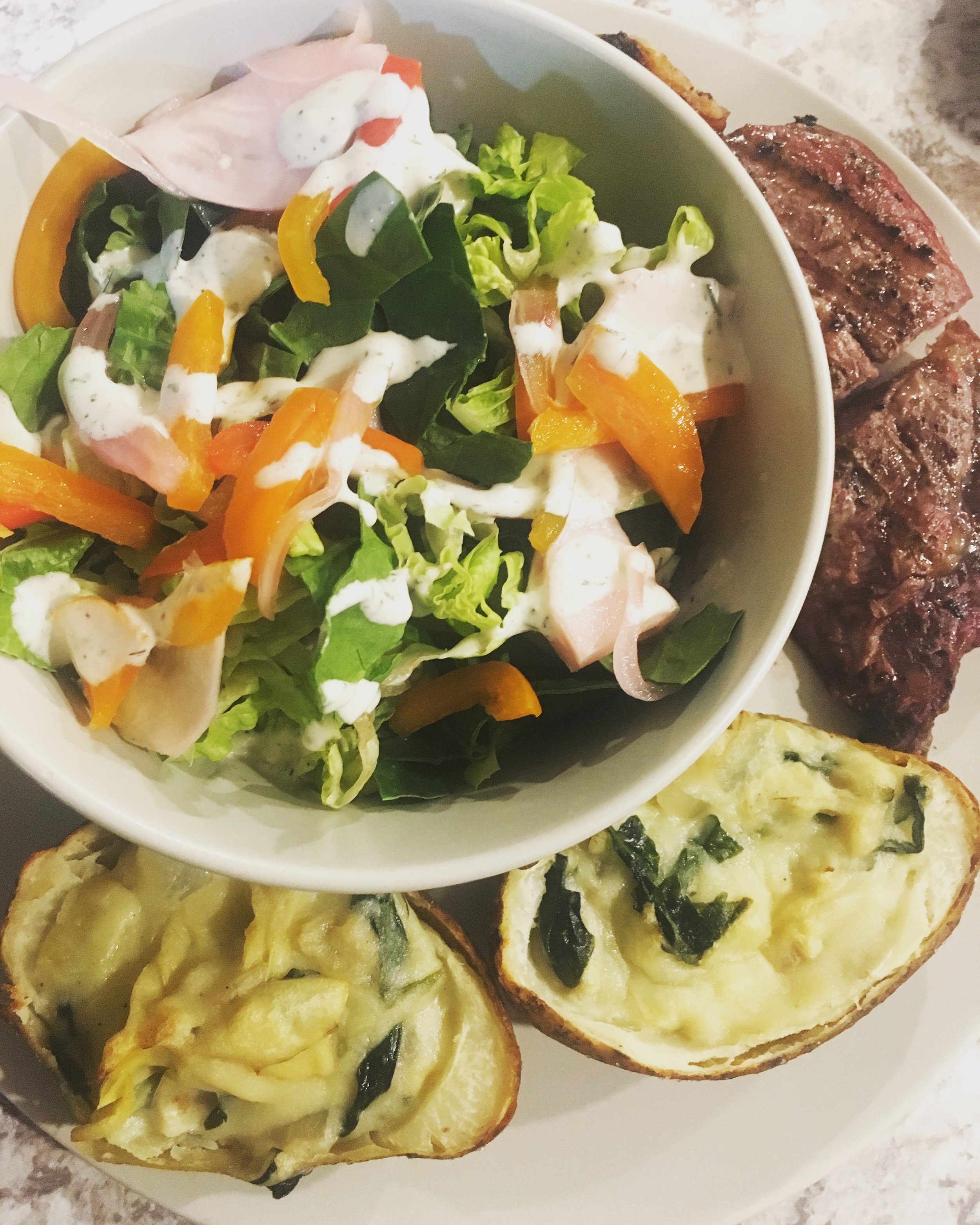 garden salad, grassfed ribeye steak, twice baked spinach artichoke potatoes