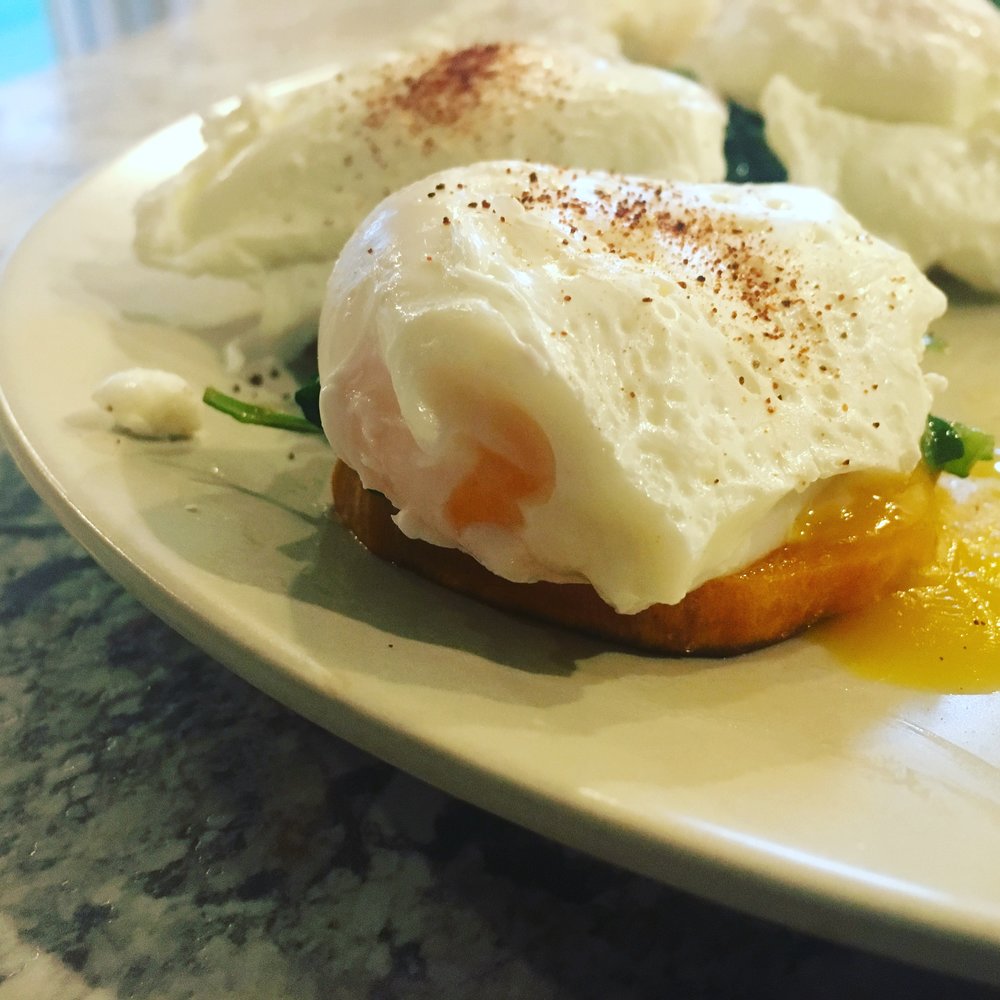 egg bites over sweet potato wedges & sauteed spinach