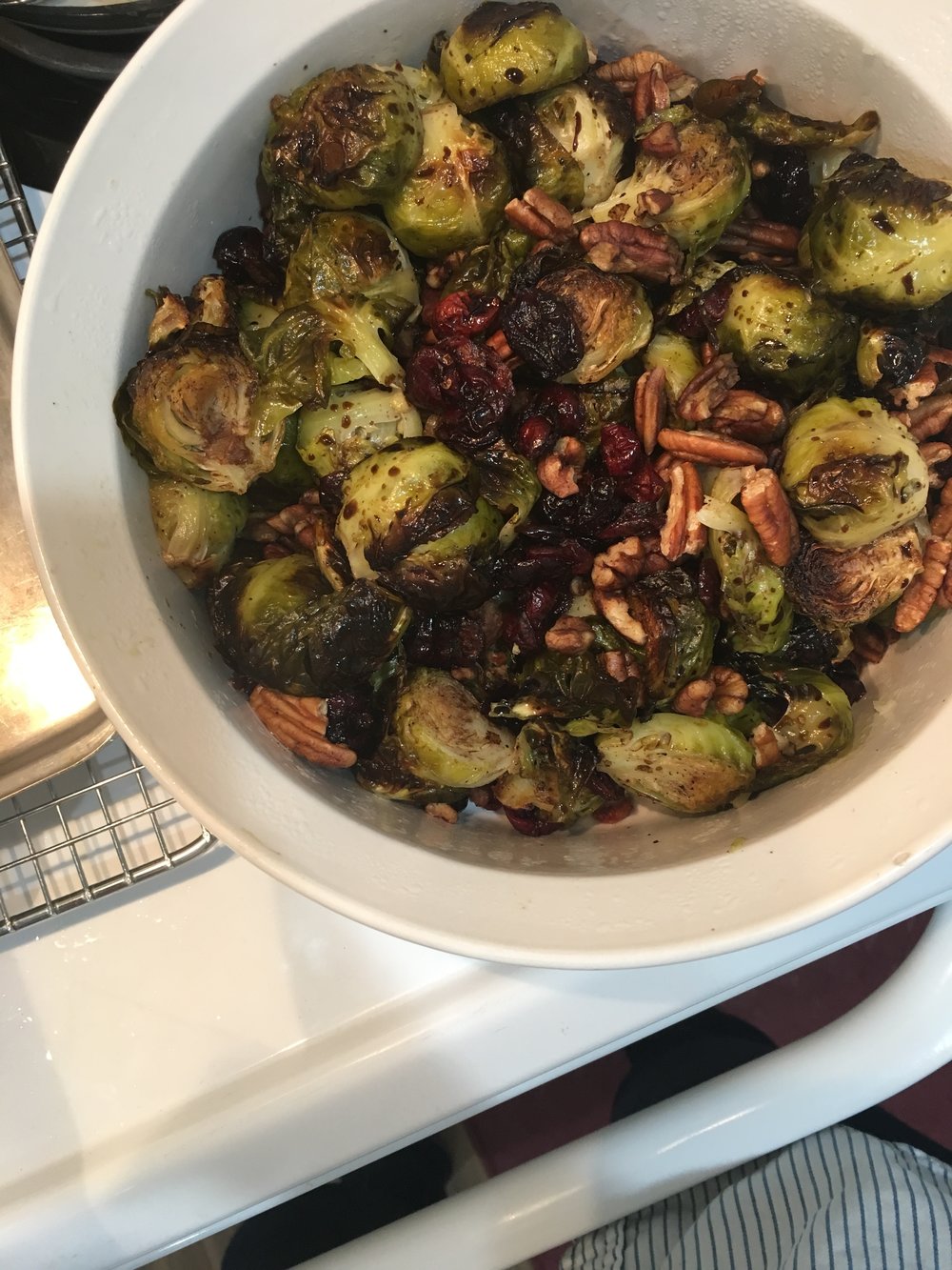 a thanksgiving dish of brussels with cranberries & pecans