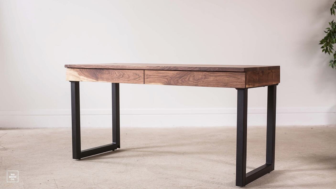 This custom desk features walnut construction, maple drawers and a sleek steel base. This desk can be customized to any size, and with any modifications you would like. View the pricing details on our website under &ldquo;shop&rdquo; and &ldquo;made 