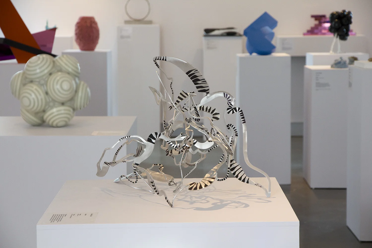 collapse , 2018. Finalist, Deakin Small Sculpture Award. Hand folded, laser cut aluminium, ink. 53 x 70 x 30cm