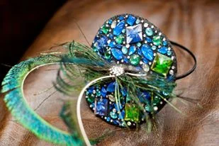 Hand beaded base with peacock sword feathers