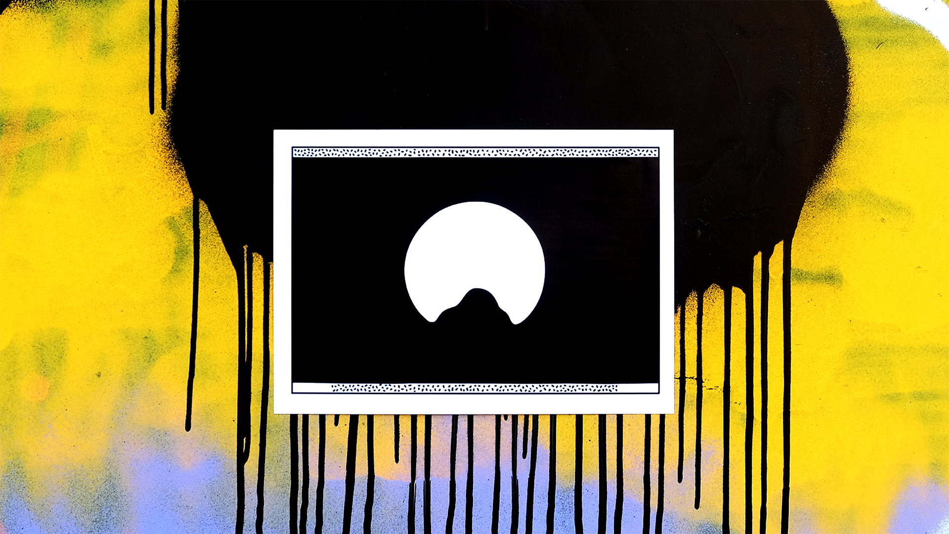 A piece of street art with a black, yellow, and purple spray-painted background, black drips on the sides, and a white framed rectangle in the center containing a black background with a white circle and a mountain-like shape inside.