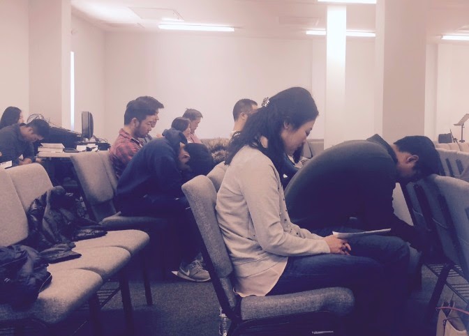 Attendees in prayer at a MoveIn event at Southern Korean Presbyterian Church in Charlotte, NC.