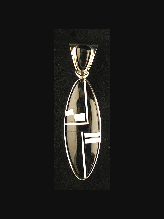 Native American jewelry Navajo silver oval pendant of magnesite and jet inlay.  2"x1/2" #MW67